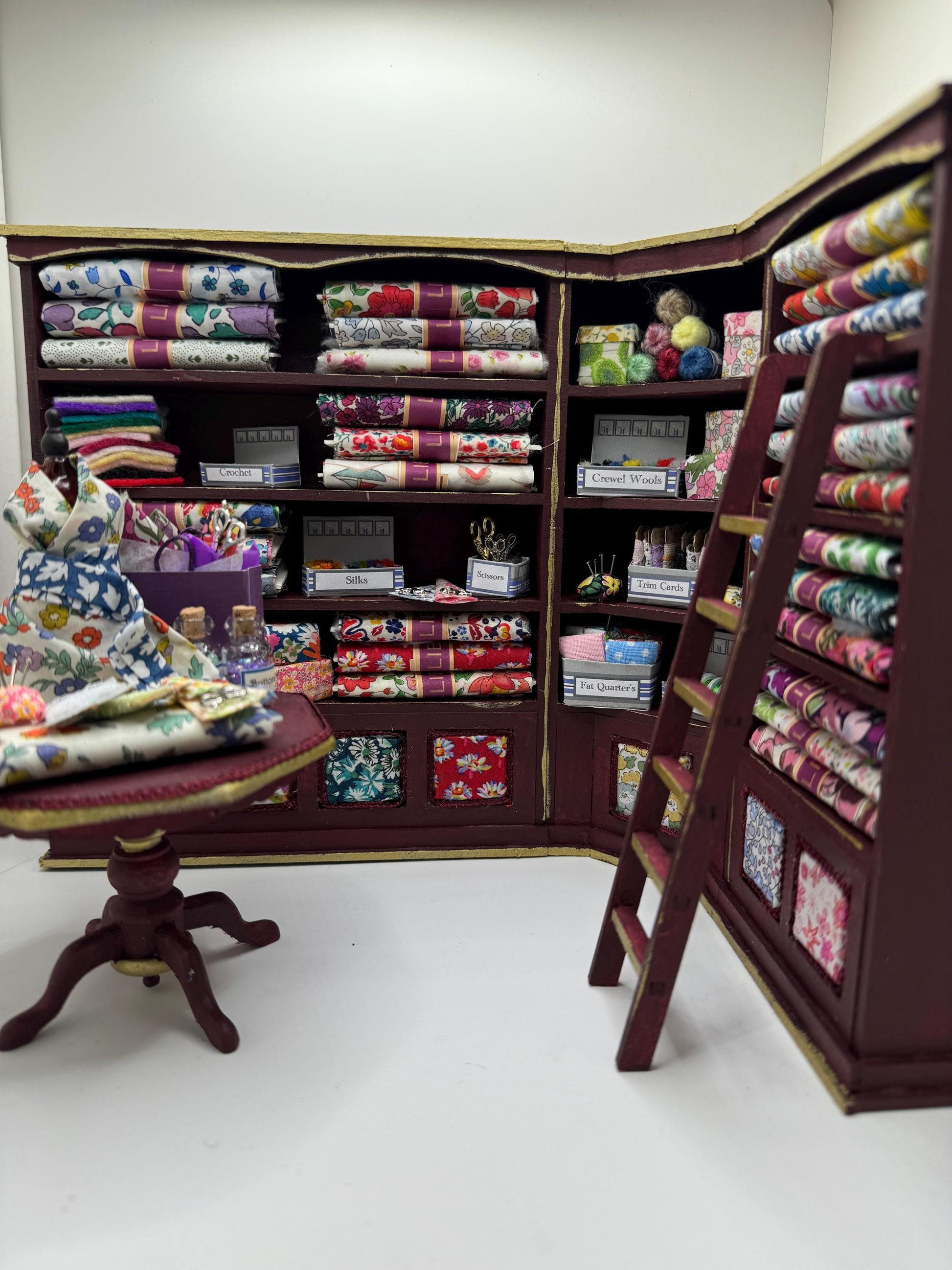 Dolls House Miniatures - 1/12th  Liberty fabric and Inspired Haberdashery Shop Shelves and display Table