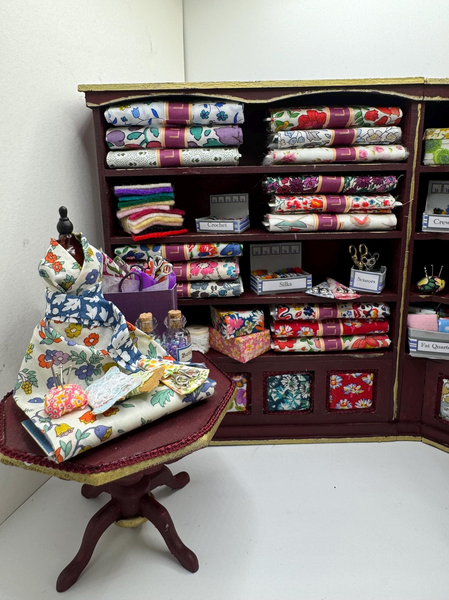 Dolls House Miniatures - 1/12th  Liberty fabric and Inspired Haberdashery Shop Shelves and display Table