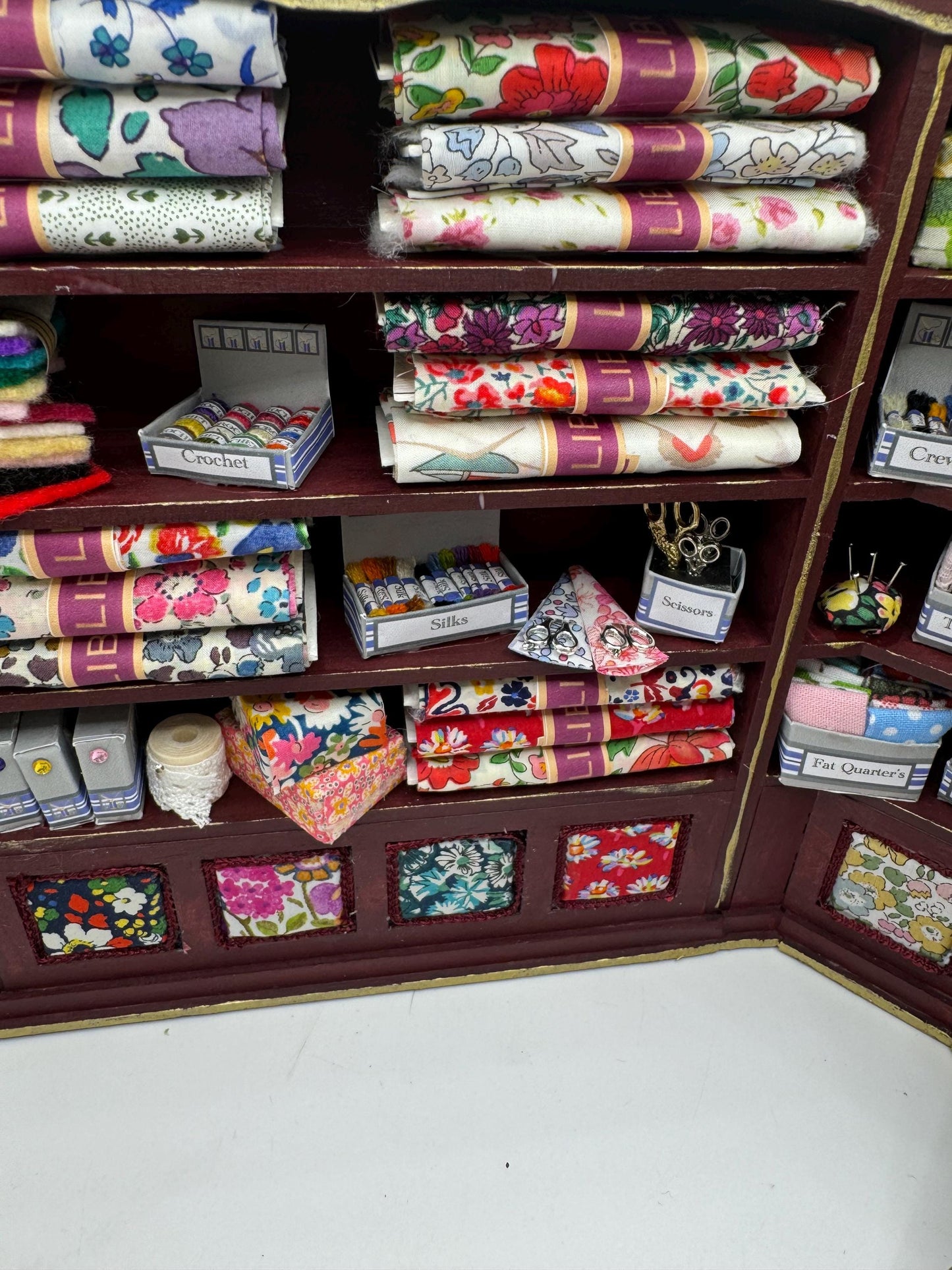 Dolls House Miniatures - 1/12th  Liberty fabric and Inspired Haberdashery Shop Shelves and display Table