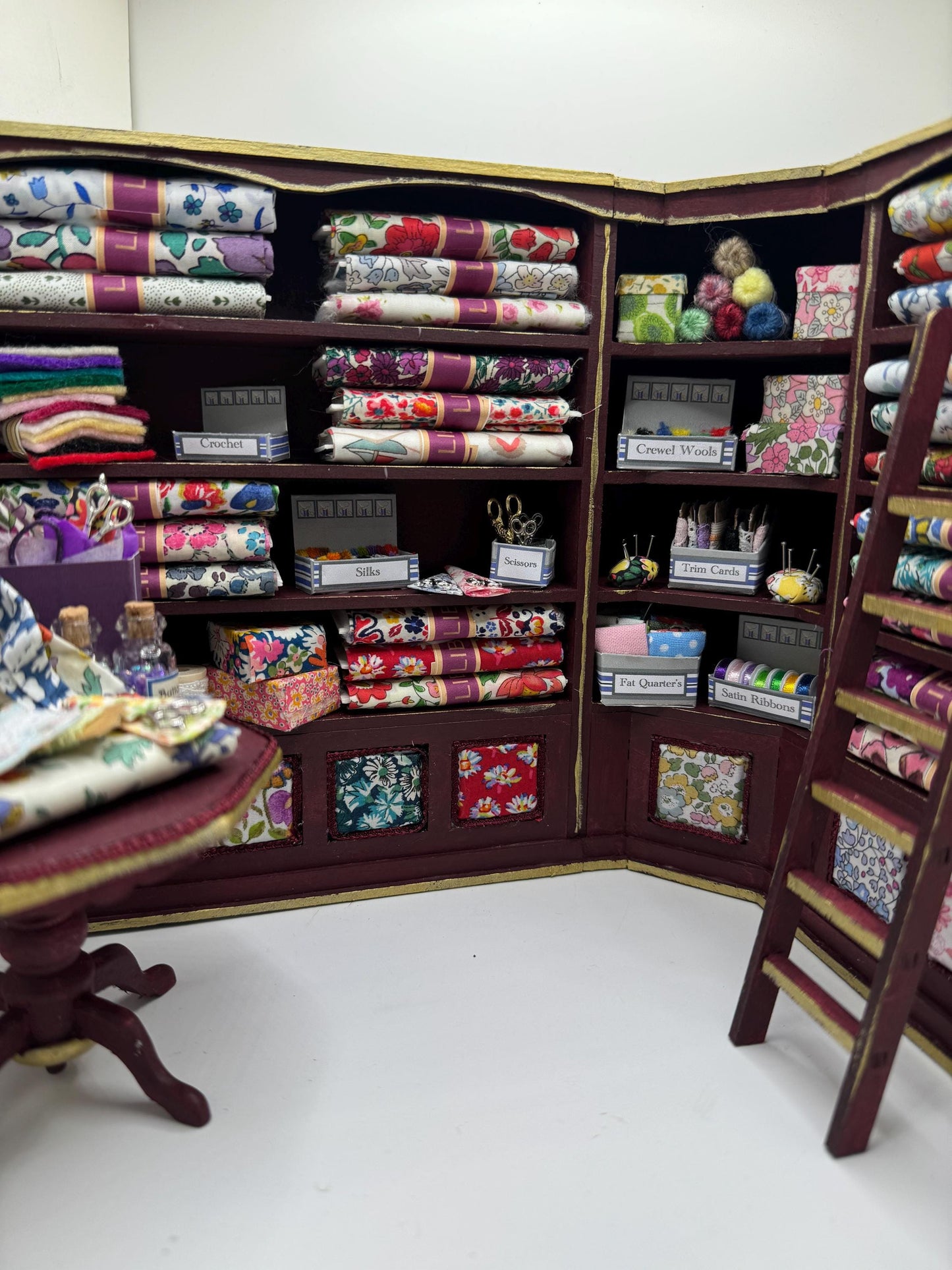 Dolls House Miniatures - 1/12th  Liberty fabric and Inspired Haberdashery Shop Shelves and display Table